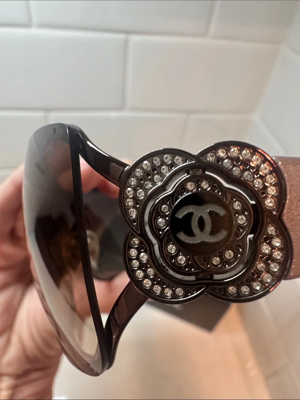 Chanel  Camellia flower with crystal-embellished interlocking CC logo